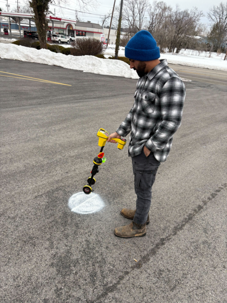 Experienced team clearing storm drains and inspecting water flow on a residential Paxtonia, PA street