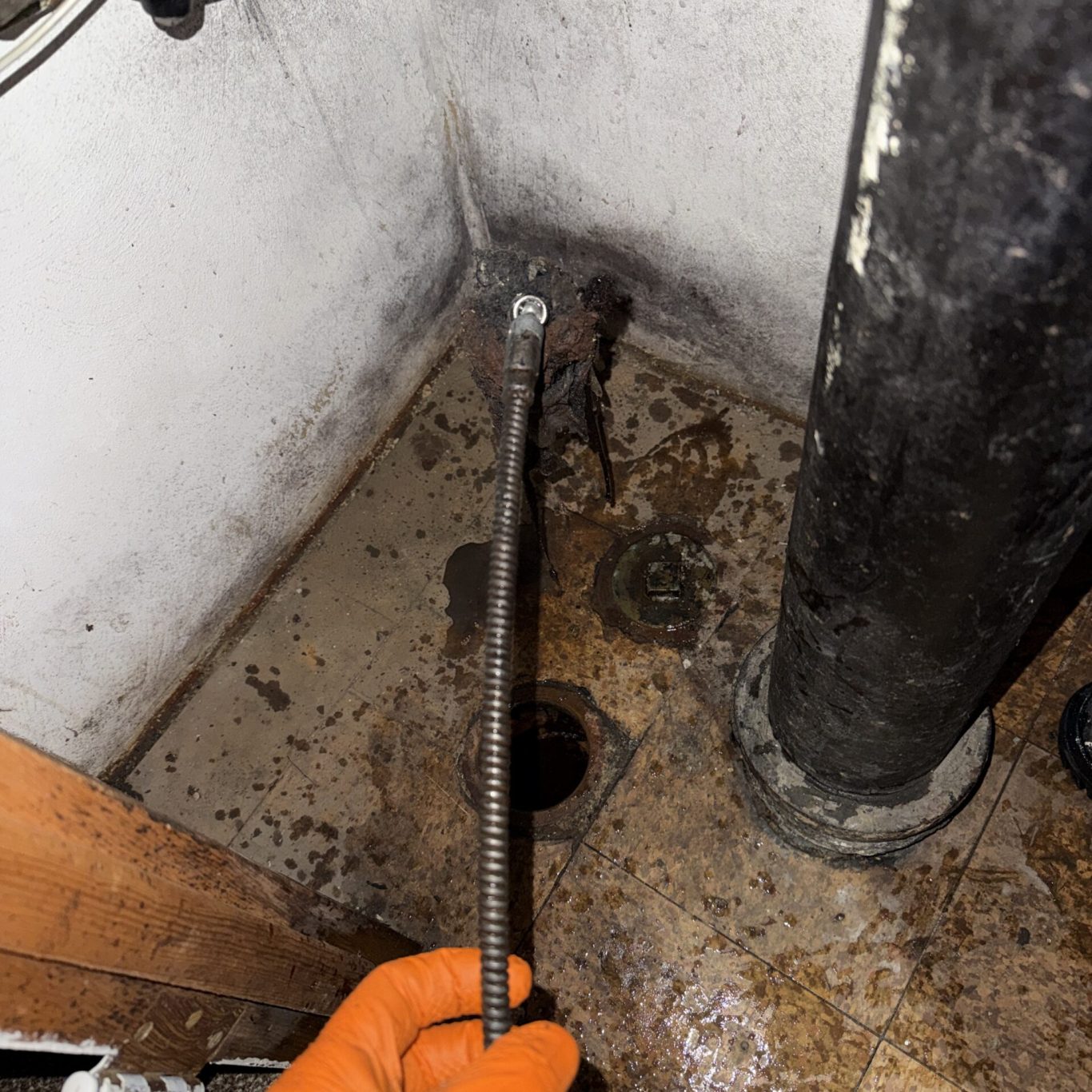 Expert plumber inspecting stormwater drain system for a historic Linglestown, PA residence