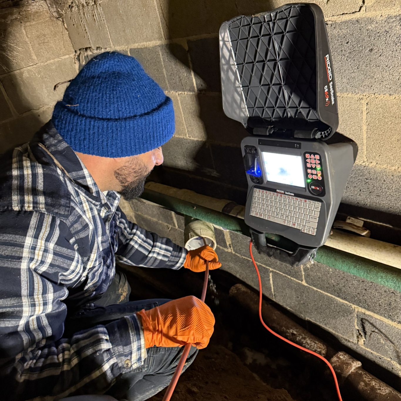 Technician performing hydro jetting in Harrisburg, PA home to clear a severe kitchen drain blockage