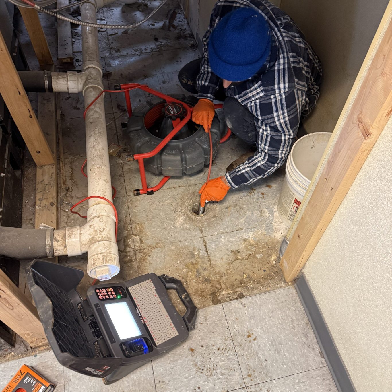 Expert plumber restoring exterior drain flow after heavy storm in Camp Hill backyard