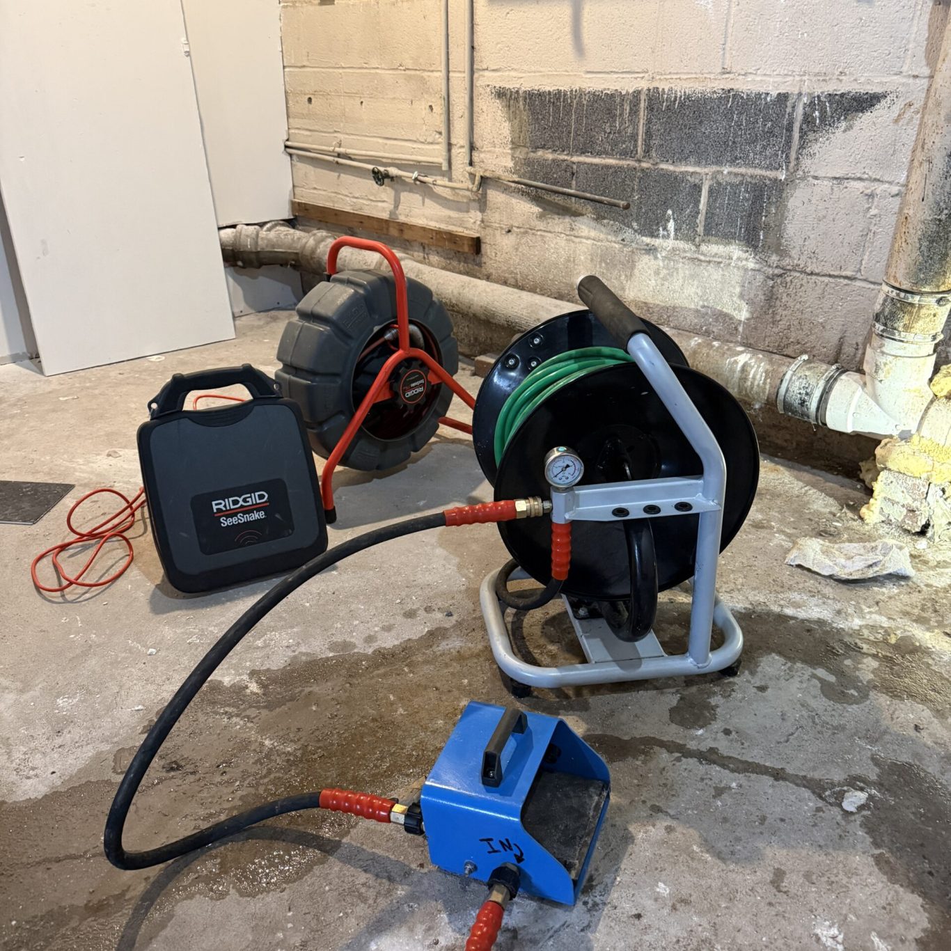 Technician performing local drainage service for a family home in Linglestown, PA after a spring rainstorm