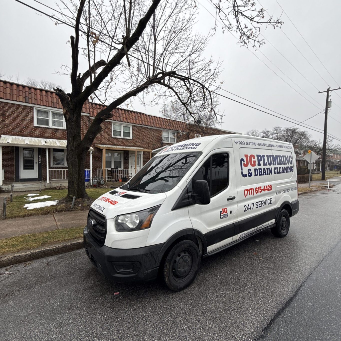 Technician performing Hydro Jetting on a blocked drain line outside a Paxtonia, PA home