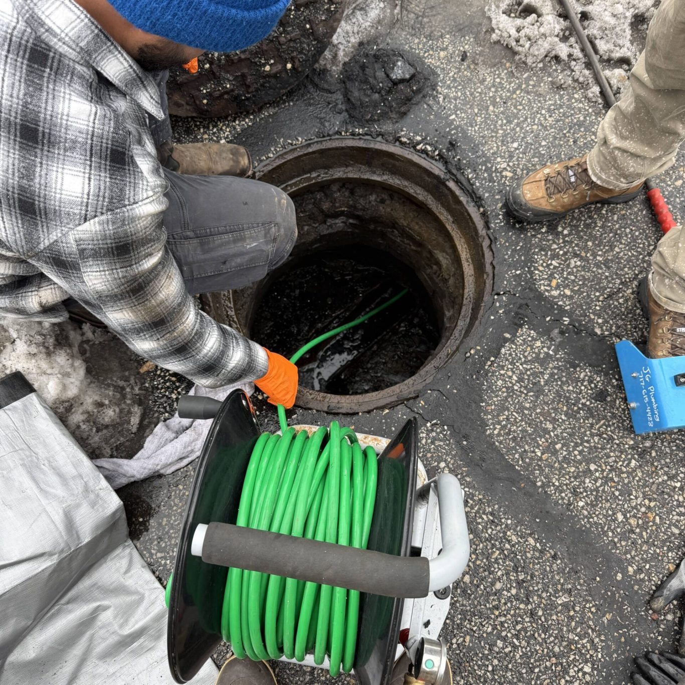 Plumber using video inspection to assess sewer line condition in Mechanicsburg, PA commercial building